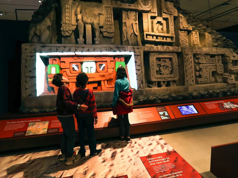 Fifth and sixth graders from Emerson Elementary School enjoy the Natural History Museum’s new show, “Maya: Hidden Worlds Revealed,” in Salt Lake City on Thursday, Nov. 8, 2018.