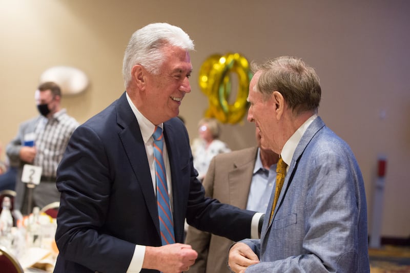 Elder Dieter F. Uchtdorf speaks with author, historian and scholar Richard Bushman at a dinner.
