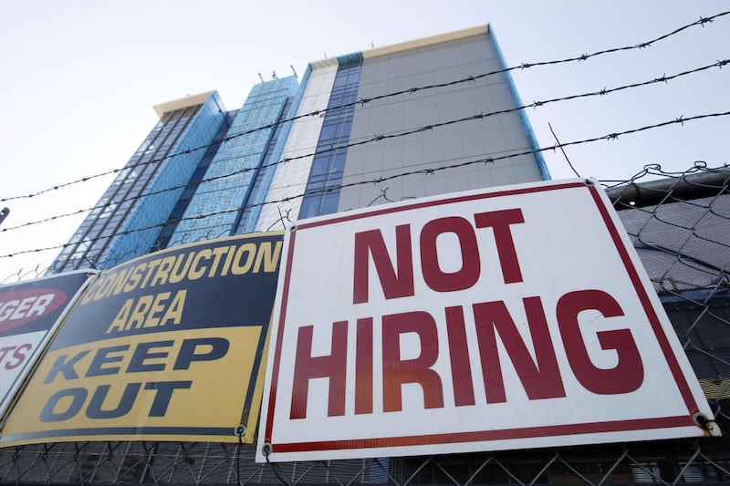In this Nov. 4, 2010 photo, a sign turning away potential job-seekers is seen outside of a construction site in New Orleans.