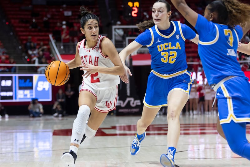Utah guard, Inês Vieira (2) drives the ball during a game against the UCLA Bruins at the Huntsman Center in Salt Lake City on Jan. 22, 2024. The Utes won during overtime 94-81.