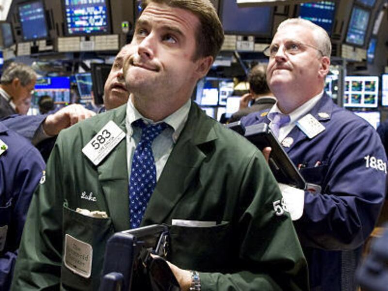 Trader Luke Dalton, foreground, watches the numbers from the floor of the New York Stock Exchange Tuesday. Stocks declined sharply Wednesday.