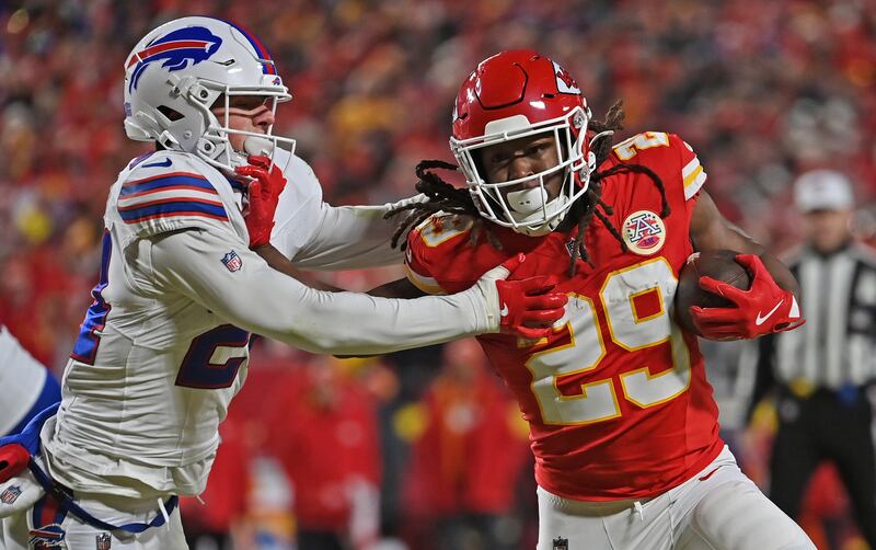 Kansas City Chiefs running back Kareem Hunt (29) runs with the ball during the AFC Championship NFL football game against Buffalo Bills safety Cole Bishop (24) Sunday, Jan. 26, 2025, in Kansas City, Mo. (AP Photo/Peter Aiken)