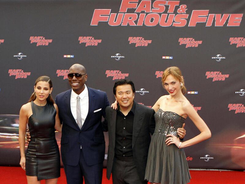 From left, Israeli actress Gal Gadot, US actor Tyrese Gibson, US director Justin Lin and Spanish actress Elsa Pataky, arrive for the German premiere of the film 'Fast and Furious Five', in Cologne, Germany, Wednesday, April 27, 2011.