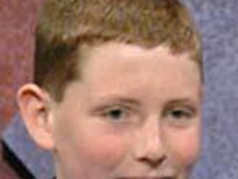 Nathan Cornelius of Cottonwood, Minn., holds up his winning answer in the National Geographic Bee.
