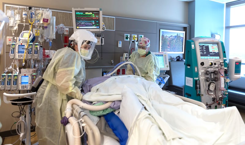 Medical staff treat a patient inside Intermountain Healthcare’s Utah Valley Hospital’s COVID-19 intensive care unit.