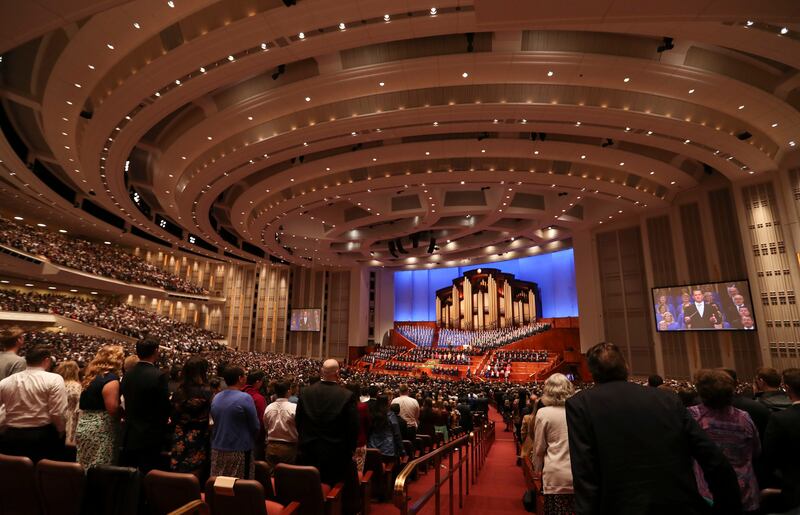 Latter-day Saints stand and sing with The Tabernacle Choir at Temple Square in the Conference Center in Salt Lake City during the morning session of the 189th Annual General Conference of The Church of Jesus Christ of Latter-day Saints on Saturday, April