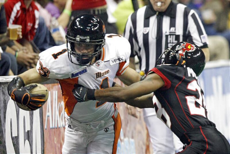 Utah Blaze wide receiver Aaron Boone stretches for a first down against the Orlando Predators. Boone leads the league in catches.