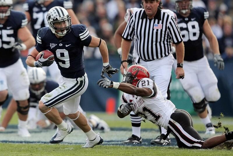 BYU WR Austin Collie (9) spins out of the tackle attempt of San Diego State DB Aaron Moore (21) as BYU and San Diego State play in Provo November 8, 2008 Photo by Scott G. Winterton/Deseret News.