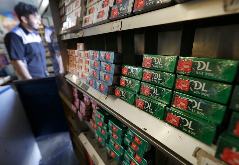 This May 17, 2018, photo shows packs of Kool menthol cigarettes displayed with other tobacco products at Ted's Market in San Francisco. R.J. Reynolds Tobacco Co. is pumping millions of dollars into a campaign to persuade San Francisco voters to reject a b