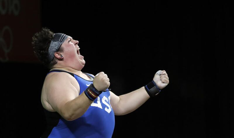 Sarah Elizabeth Robles, of the United States, celebrates after a lift during the women's 75kg weightlifting competition at the 2016 Summer Olympics in Rio de Janeiro, Brazil, Sunday, Aug. 14, 2016. (AP Photo/Mike Groll)