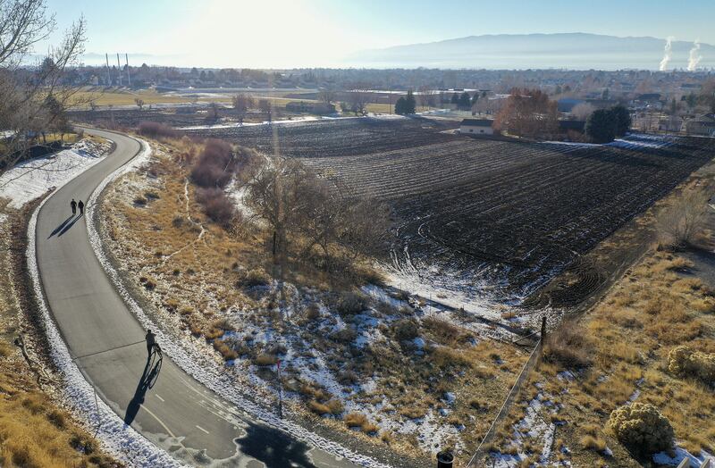 People walk and bike on the Murdock Canal Trail in Lindon on Dec. 21, 2020. It is one of a handful of canal trails that already exist in Utah.