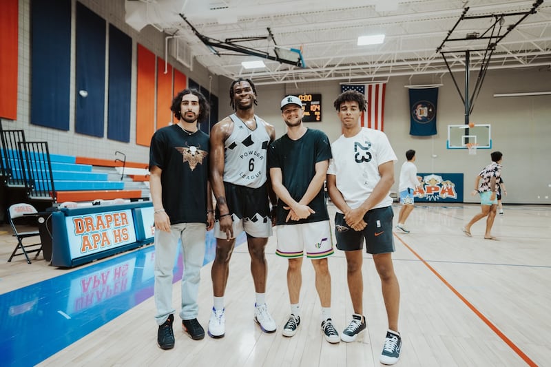 Neema Namdar, former Utah Jazz player Jarrell Brantley, Keegan Rembacz and Blaze Nield stand for a photo after a summer league game.