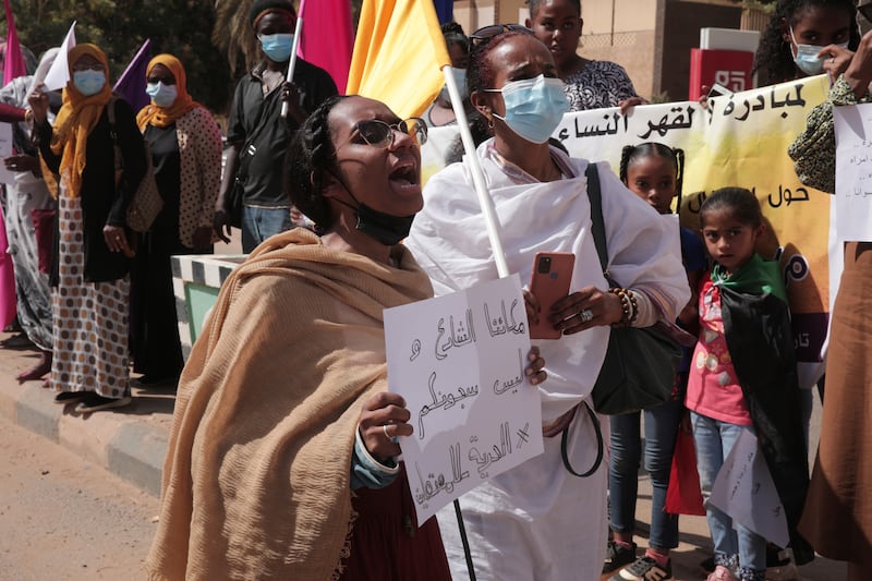 Women chant slogans protesting violence against women and demanding the release of all detainees in Sudan in 2022.