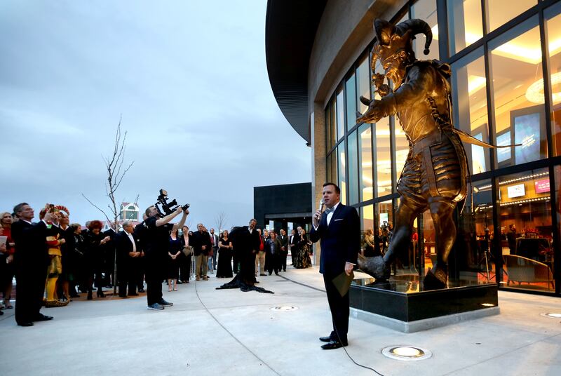 Rob Brough, Hale Center Theatre board chair, unveils the jester statue at the grand opening of the new Hale Centre Theatre in Sandy on Thursday, Nov. 16, 2017.
