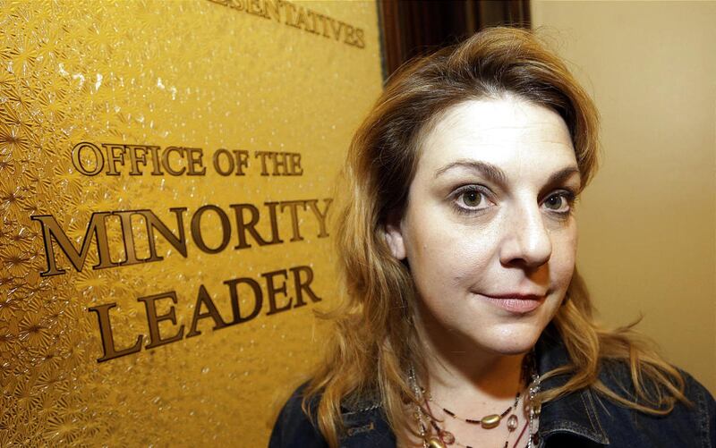 Minority leader, Rep. Jennifer Seelig, D-Salt Lake, stands in front of her office door in Salt Lake City, Feb. 2013.
