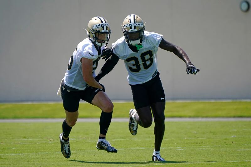 New Orleans Saints safeties Smoke Monday (38) and Daniel Sorensen run through drills.