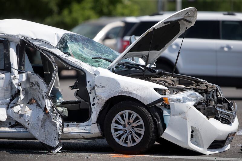 A car that collided with a pickup truck in the intersection of 900 West and State Street in American Fork is pictured on Friday, July 13, 2018.