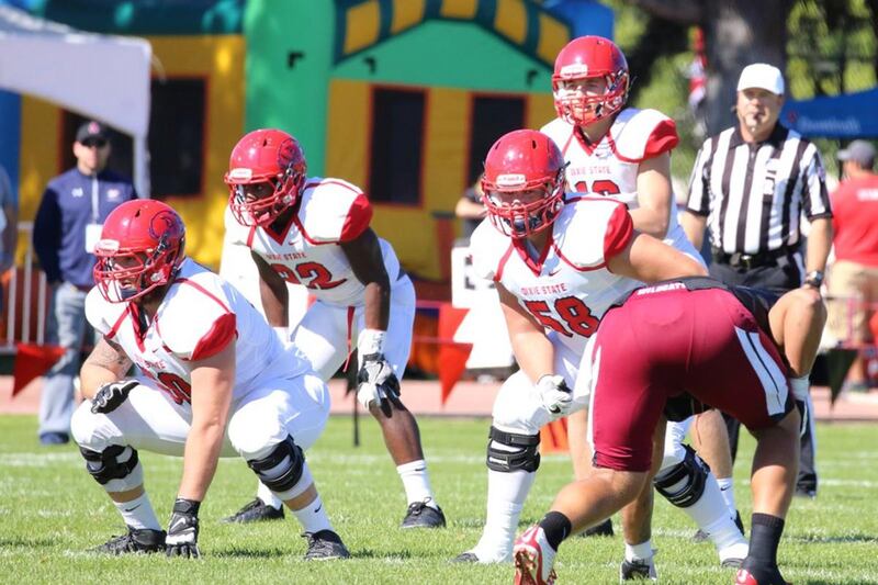 Dixie State freshman quarterback Josh Thompson (back-center) sets to take a snap at Central Washington on Sept. 24. Thompson and the Trailblazers head to Grand Junction, Colorado, for a matchup with No. 23 Colorado Mesa on Saturday.
