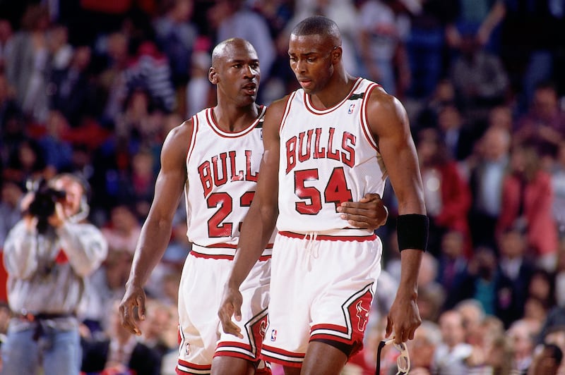 CHICAGO - MAY 19: Michael Jordan #23 comforts teammate Horace Grant #54 of the Chicago Bulls during Game One of the Eastern Conference Finals against the Cleveland Cavaliers played on May 19, 1992 at Chicago Stadium in Chicago, Illinois.