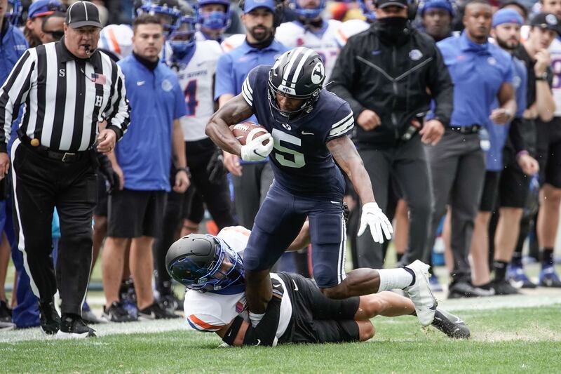 BYU wide receiver Chris Jackson (5) gets tackled by Boise State cornerback Kaonohi Kaniho.