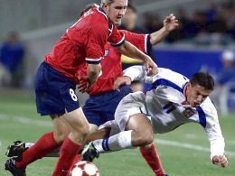 U.S.'s Danny Califf battles Milan Baros, right, of Czech Republic during Olympic soccer match in Canberra, Australia.