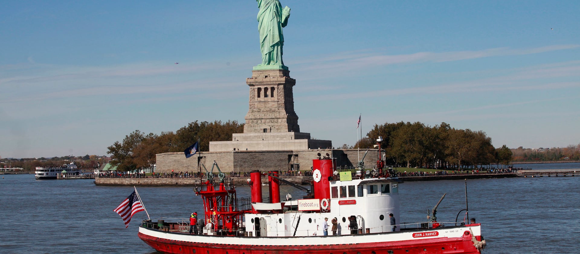 The fireboat John J. Harvey passes the Statue of Liberty on Friday, Oct. 28, 2011, in New York Harbor.