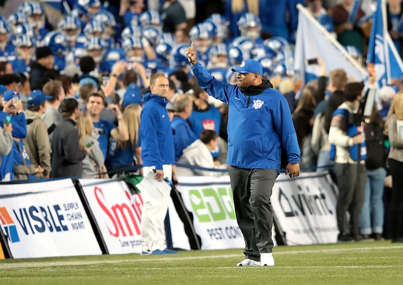 Brigham Young Cougars head coach Kalani Sitake gives the fans a shaka prior to the BYU-Virginia game.