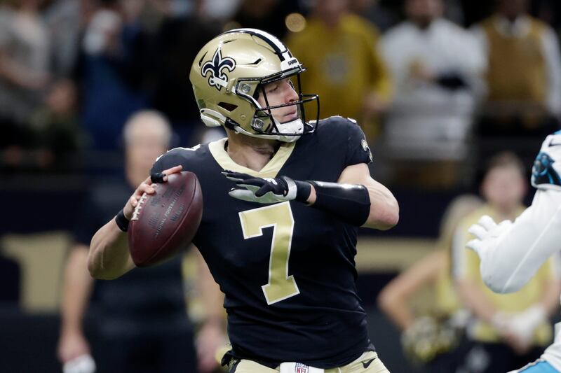 New Orleans Saints quarterback Taysom Hill passes in the first half against the Carolina Panthers.