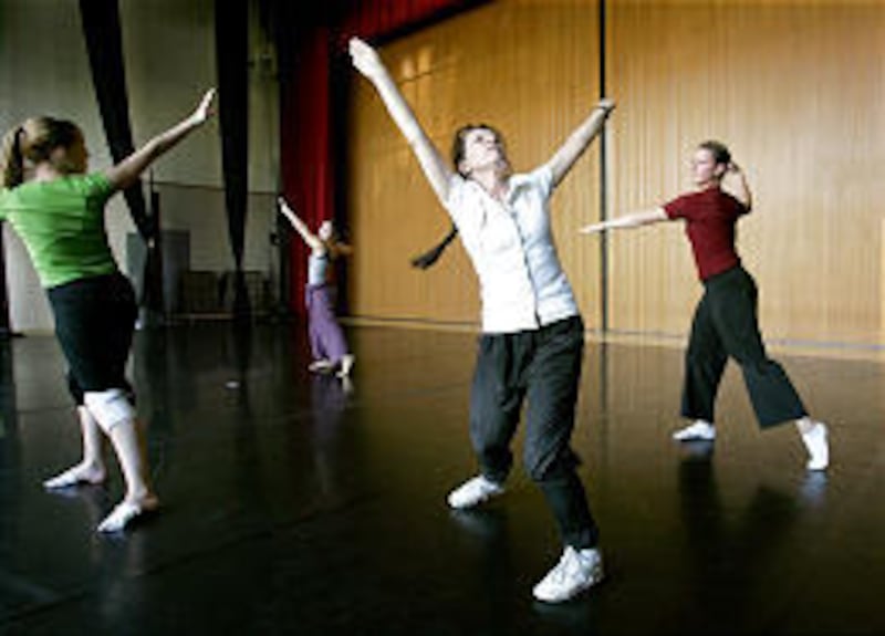 Choreographer Lila York, center, works with BYU's Alisa Poston, left, Lisa Rivera and Amy Bastian on "Esplanade" in September 2005.