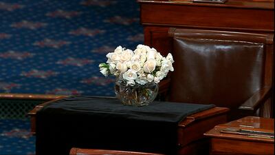 The desk of Sen. John McCain, R-Ariz., is draped in black on the floor of the U.S. Senate on Monday, Aug. 27, 2018, on Capitol Hill in Washington. McCain died at the age of 81, on Aug. 25, 2018, after battling brain cancer. (Senate Television via AP)