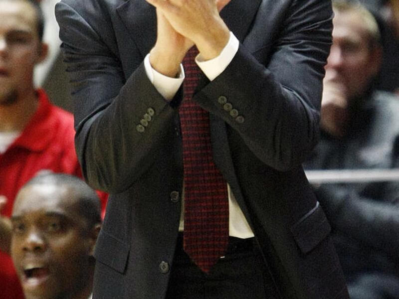 Southern Utah head coach Nick Robinson sheers his team on in an NCAA men's college basketball game against the Utah Utes at the Jon M. Huntsman Center in Salt Lake City, Friday, Nov. 13, 2015.