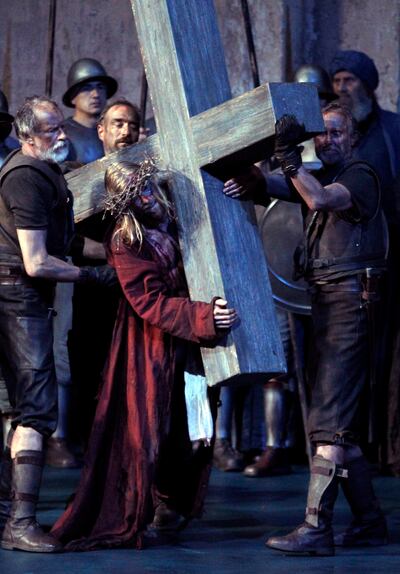 In this May 10, 2010 file photo Andreas Richter as Jesus, center, performs with laymen during a dress rehearsal of the passion plays 2010 in the theatre of Oberammergau, southern Germany. More than 2000 citizens of this Bavarian village participate in the