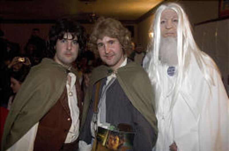 From left, Shawn Gordon of Ogden joins Shane and Julie Gordon of Preston, Idaho, at Slamdance's "Rings: Lord of the Fans" premiere in Park City.