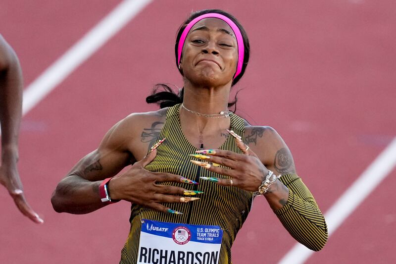 Sha'Carri Richardson celebrates her win in the wins women's 100-meter run final during the U.S. Track and Field Olympic Team Trials Saturday, June 22, 2024, in Eugene, Ore.