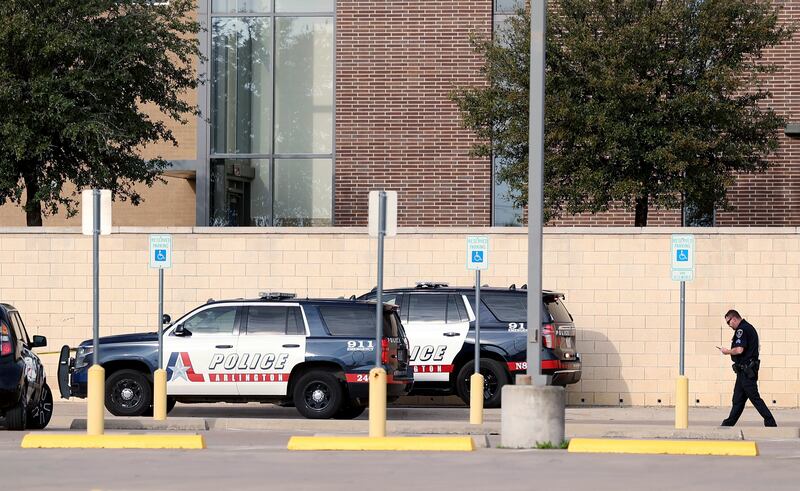Arlington police investigate a shooting at Lamar High School in Arlington, Texas.