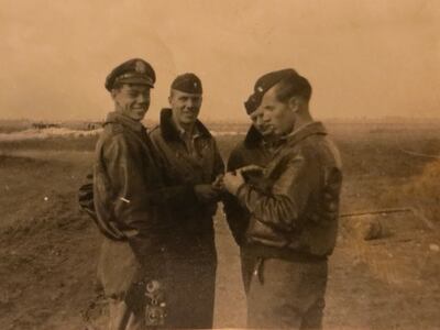 Jerry Kelly, left, and Bob Sharp, right, shoot the breeze with other pilots somewhere in France or Belgium shortly after arriving in Europe in the fall of 1944.