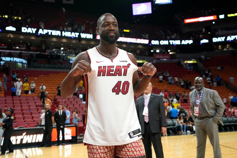 Former Miami Heat player Dwyane Wade wears a Heat jersey at an April 9, 2023, game.