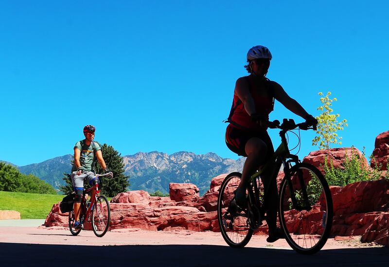 Bicyclists ride into the tunnel under 1300 East at Sugar House Park in Salt Lake City on June 22, 2020.