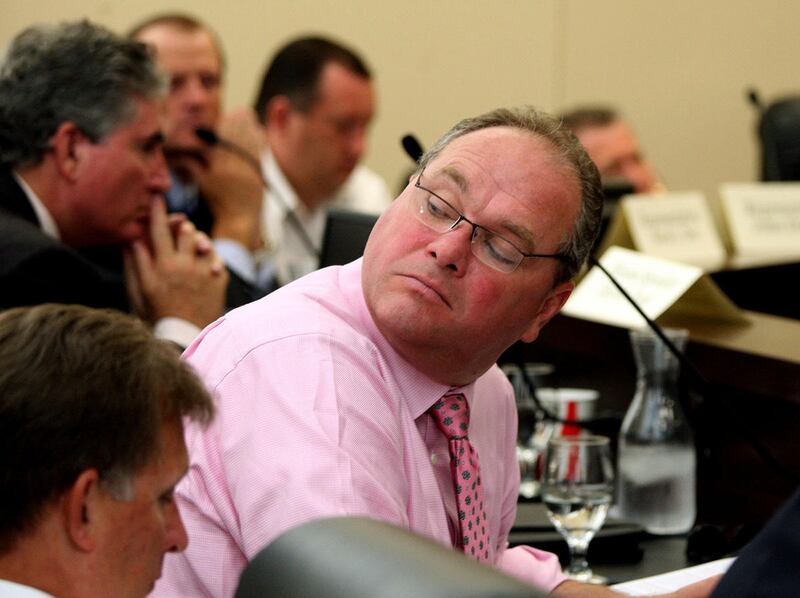 FILE - Ken Bullock, Utah League of Cities and Towns, listens during the Immigration Roundtable hosted by Governor Gary R. Herbert at the State Capitol. Bullock resigned Wednesday, the day before an audit says he improperly charged about $57,000 to the ta