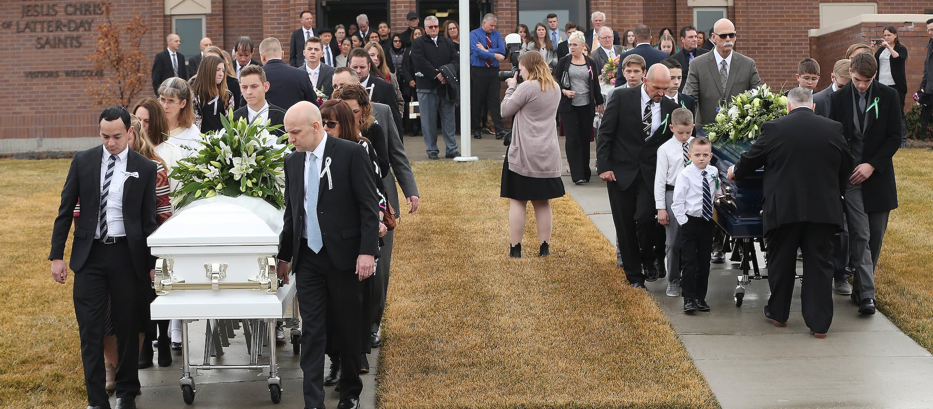 Pallbearers move the caskets of Consuelo Alejandra Haynie, and three of her children — Alexis, Matthew and Milan — following their funeral in Grantsville on Jan. 24, 2020.