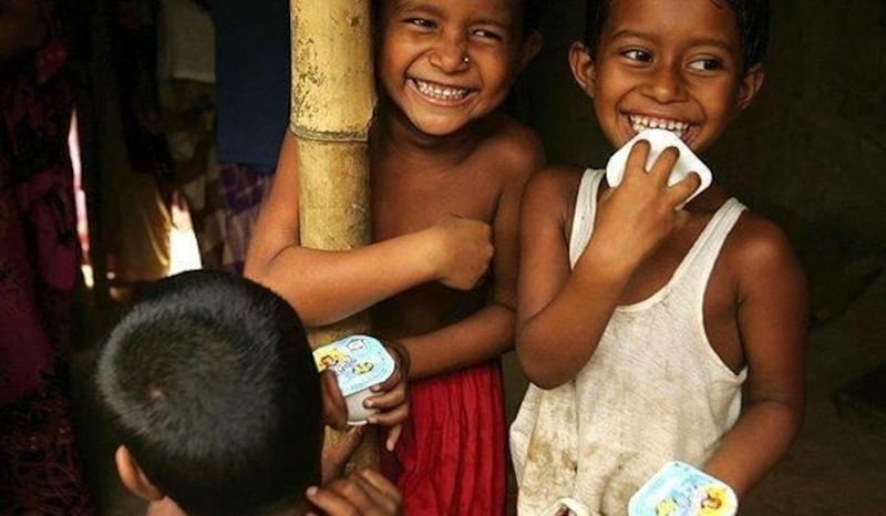 Bangladeshi children enjoy Grameen Danone's fortified yogurt.