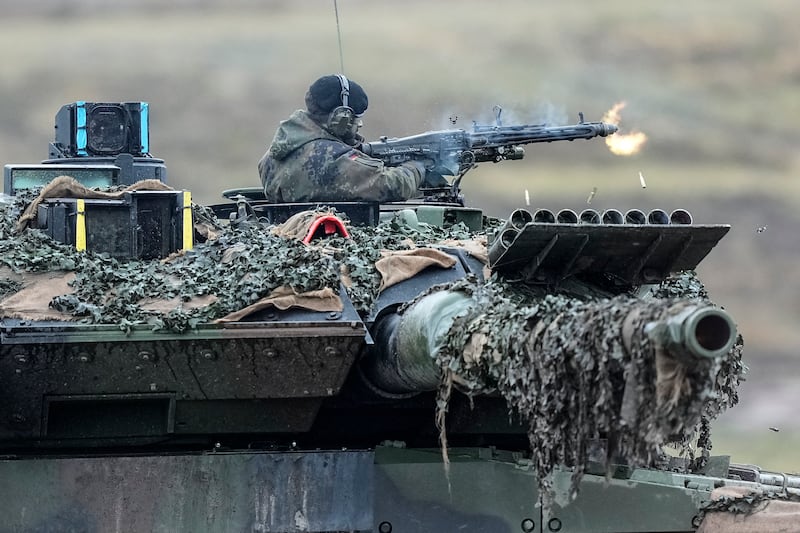 A soldier on a Leopard 2 tank operates at the Field Marshal Rommel Barracks in Augustdorf, Germany, Feb. 1, 2023.
