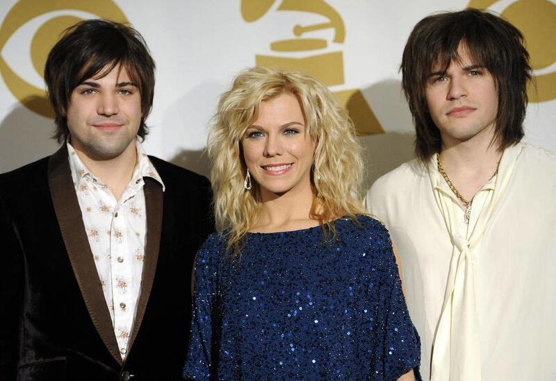 FILE - In this Nov. 30, 2011 file photo, The Band Perry, from left, Neil, Kimberly, and Reid Perry, pose backstage at the Grammy Nominations Concert in Los Angeles. The sibling trio was nominated for their first Grammy last year but lost. They call it "bi