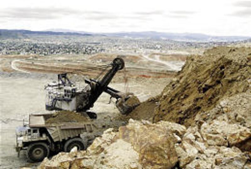A shovel operator loads a haul truck in the Continental Pit at Montana Resources in Butte, Mont. Closed in 2000, the mine reopened last fall.