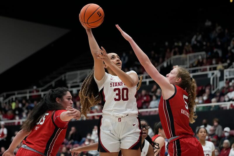 Stanford guard Haley Jones (30) shoots between Utah forward Alissa Pili, left, and guard Gianna Kneepkens during the second half of an NCAA college basketball game in Stanford, Calif., Friday, Jan. 20, 2023. (AP Photo/Godofredo A. Vásquez)