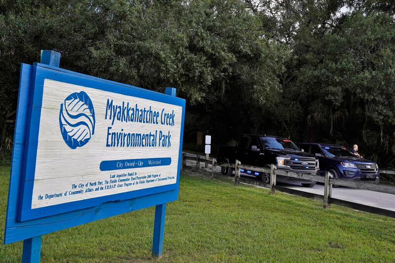 North Port, Fla., police officer block the entrance to the Myakkahatchee Creek Environmental Park. The FBI in Tampa, Florida, said Wednesday that authorities had found human remains — as well as a backpack with other items that belonged to Brian Laundrie — at at Florida park.