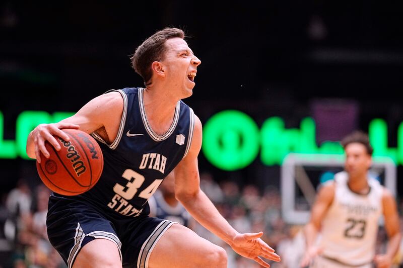 Utah State forward Justin Bean goes to the basket