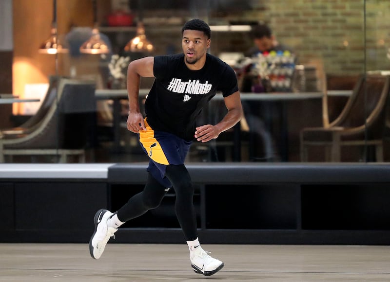 Jared Butler runs during practice