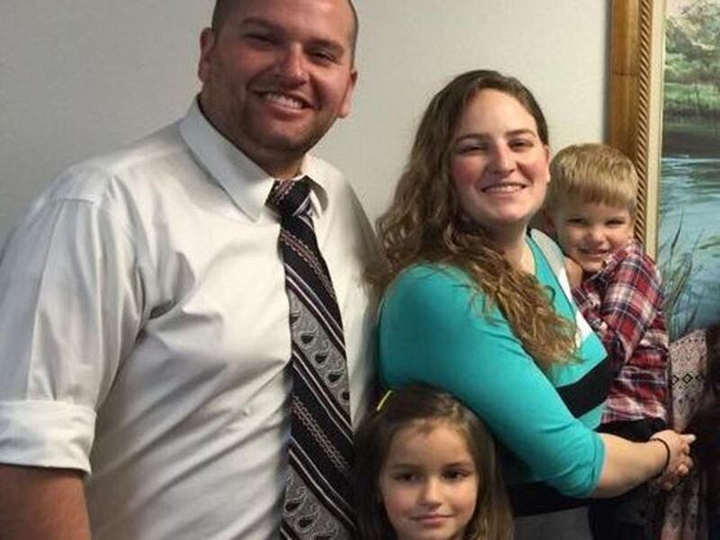 Meaghan Blair, 29, of Arkansas poses with her husband, Michael, and their two children. Blair died after experiencing health problems during a Mormon youth trek activity in Oklahoma on Monday, June 20, 2016.