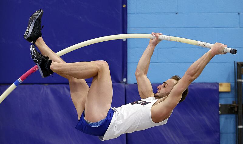 BYU pole vaulter Zach McWhorter goes up for a vault as he trains with his dad, Rick, who is also his coach.